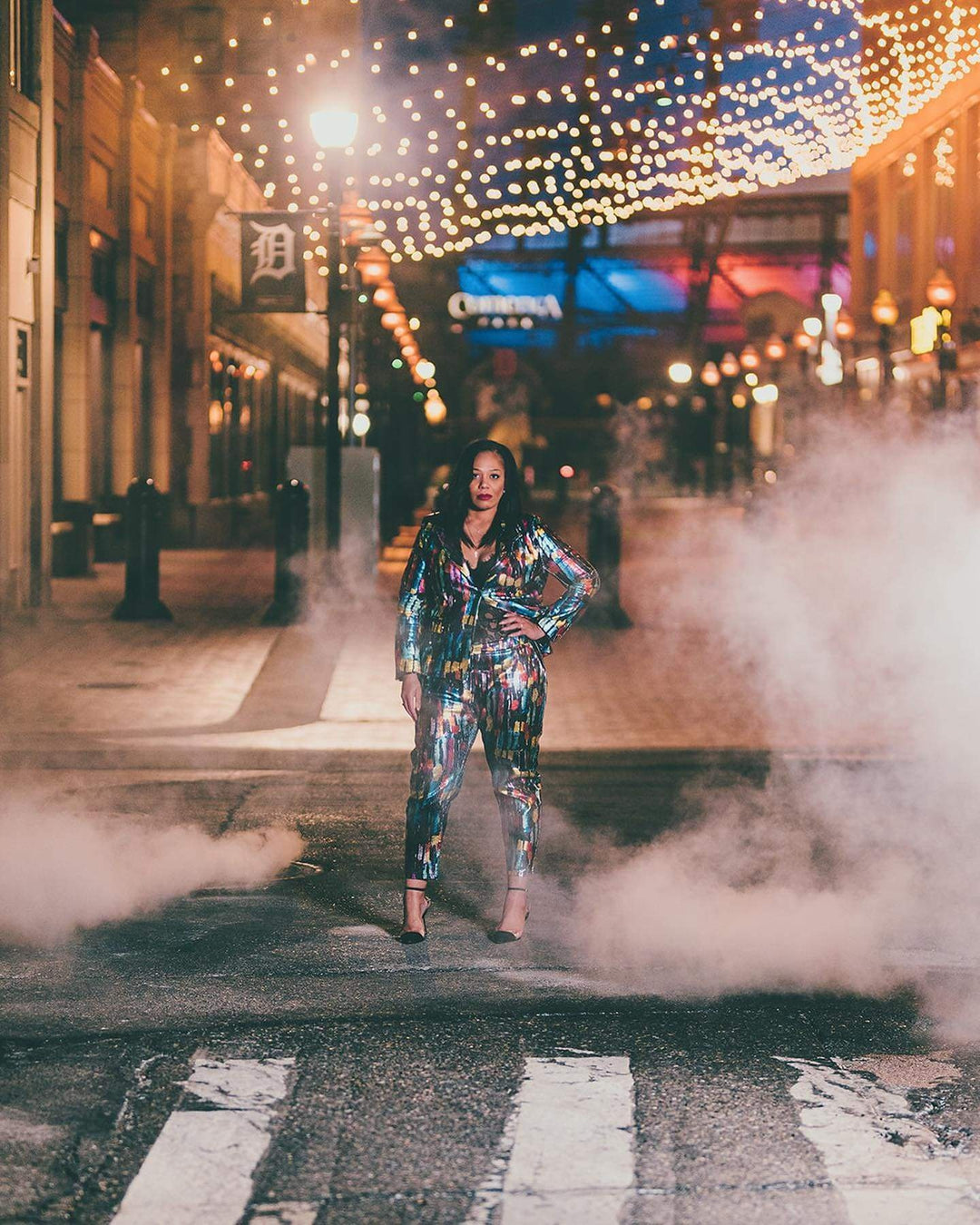woman in smoke wearing plus size sequin suit